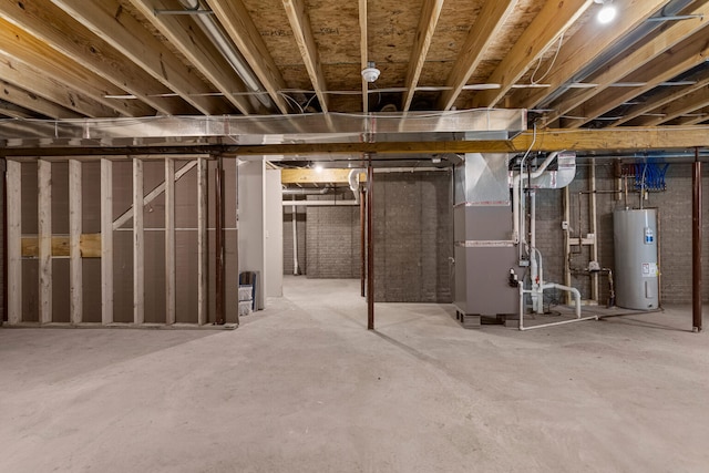 605 Wheatley Dr, Mahomet, IL 61853 - unfinished basement with water heater and heating unit
