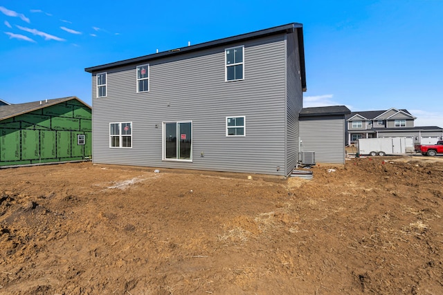 605 Wheatley Dr, Mahomet, IL 61853 - back of property featuring central AC unit