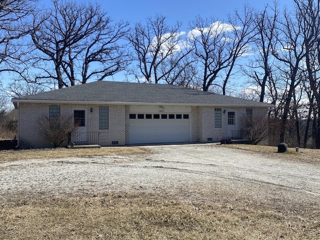 ranch-style house with crawl space, driveway, a garage, and brick siding