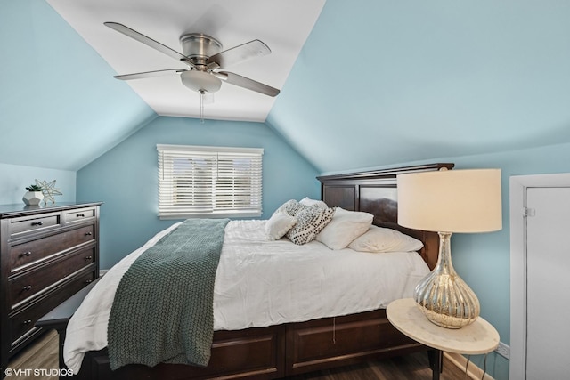 bedroom featuring vaulted ceiling, a ceiling fan, and wood finished floors