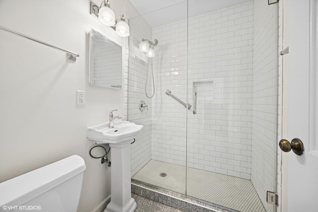 full bathroom featuring toilet and a stall shower