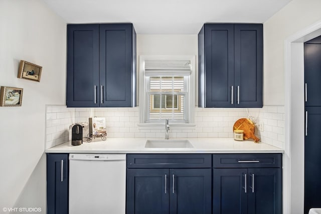 bar with decorative backsplash, white dishwasher, and a sink