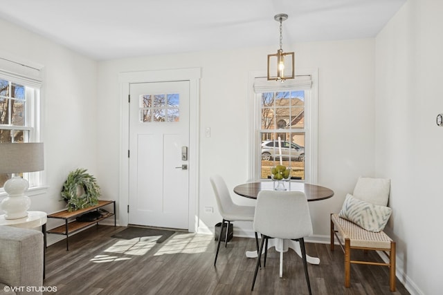 dining area with wood finished floors and baseboards