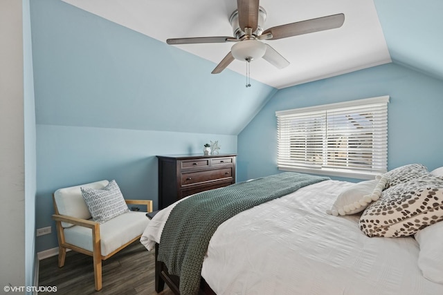 bedroom featuring ceiling fan, baseboards, lofted ceiling, and wood finished floors