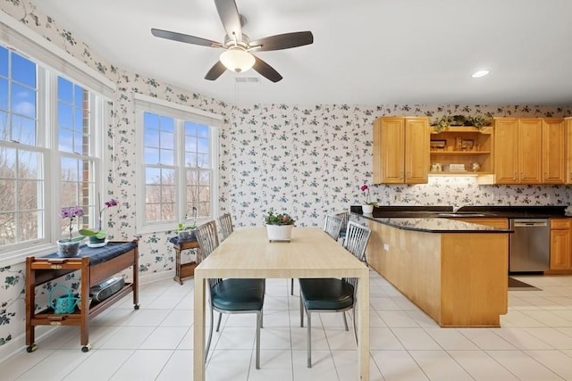 kitchen featuring a peninsula, dishwasher, open shelves, dark countertops, and wallpapered walls