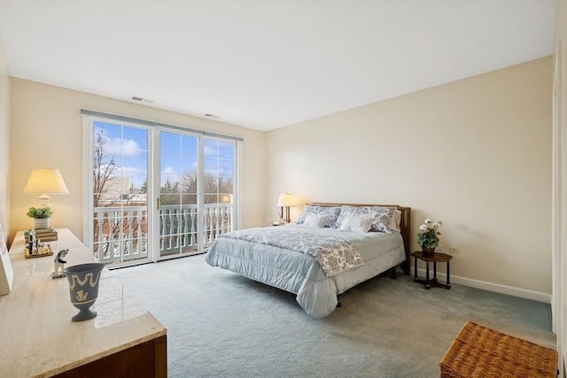 carpeted bedroom with access to exterior, visible vents, and baseboards