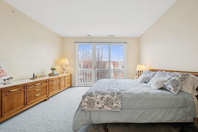 bedroom with light carpet and visible vents