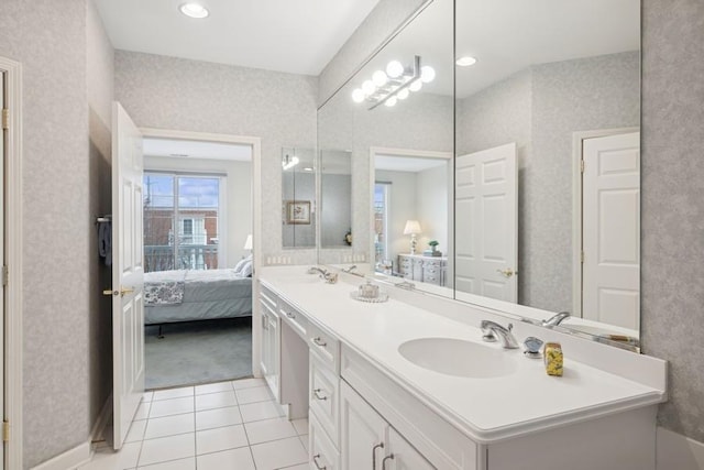 full bathroom with wallpapered walls, ensuite bath, and a sink