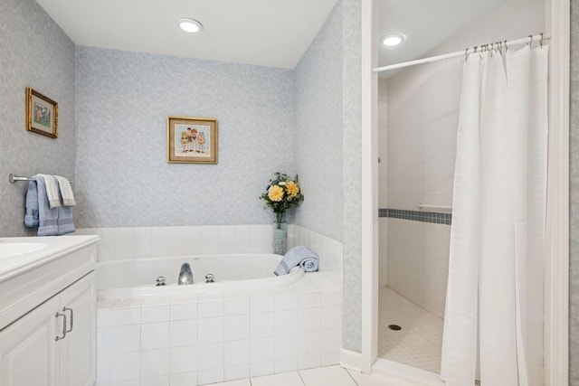 full bath featuring tile patterned flooring, vanity, a bath, a stall shower, and wallpapered walls