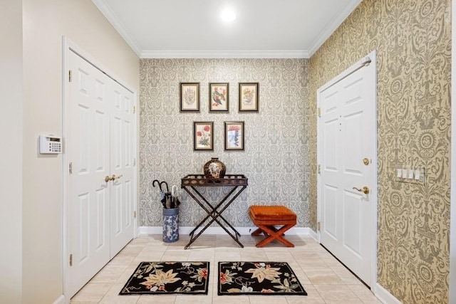 entryway featuring ornamental molding, baseboards, and wallpapered walls