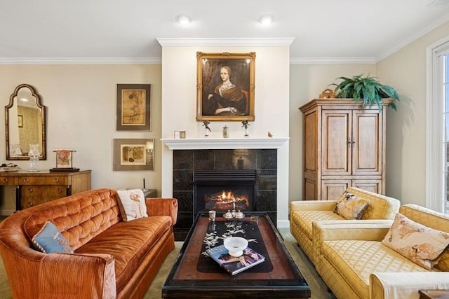 living area featuring ornamental molding and a tiled fireplace