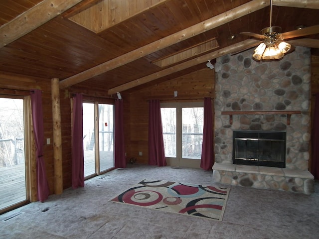 unfurnished living room featuring vaulted ceiling with beams, visible vents, a fireplace, and wooden ceiling