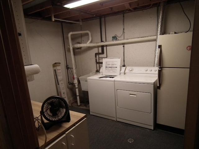 laundry area with a sink, laundry area, and washing machine and dryer