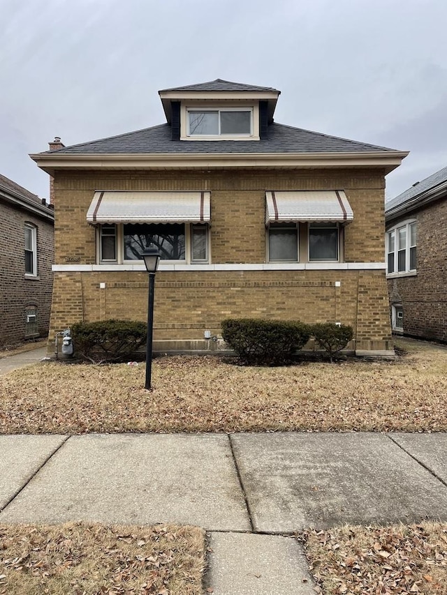 view of front of property featuring brick siding