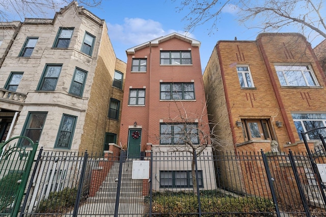 multi unit property featuring a fenced front yard