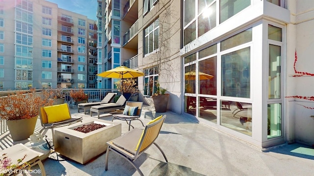 view of patio / terrace featuring a fire pit