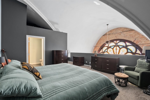 carpeted bedroom with vaulted ceiling