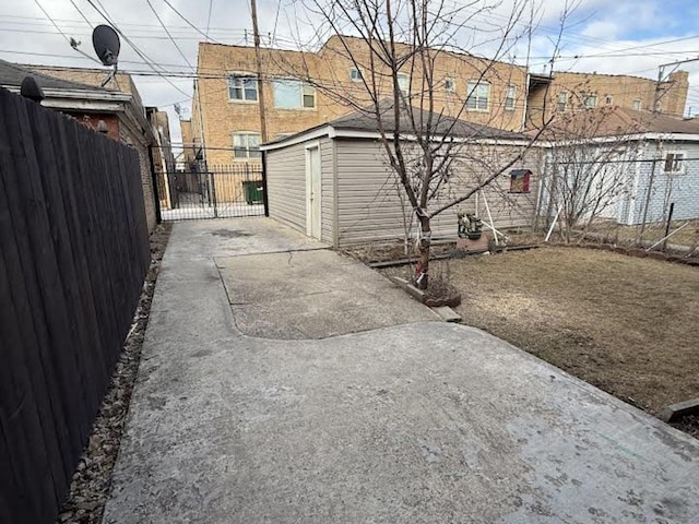 view of side of property featuring a patio area and fence