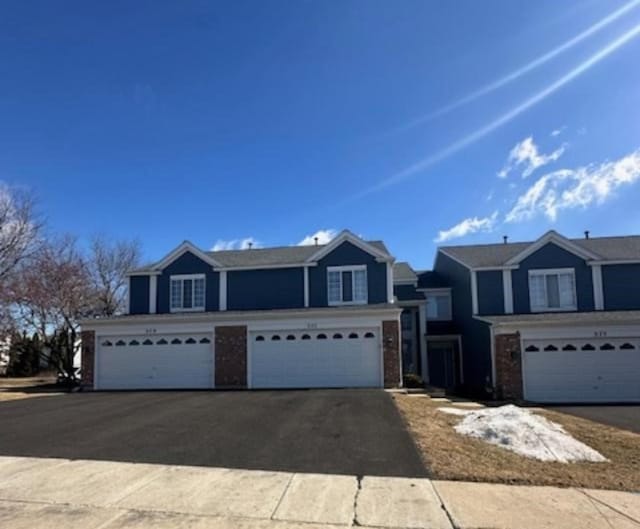 view of front of property featuring driveway and a garage