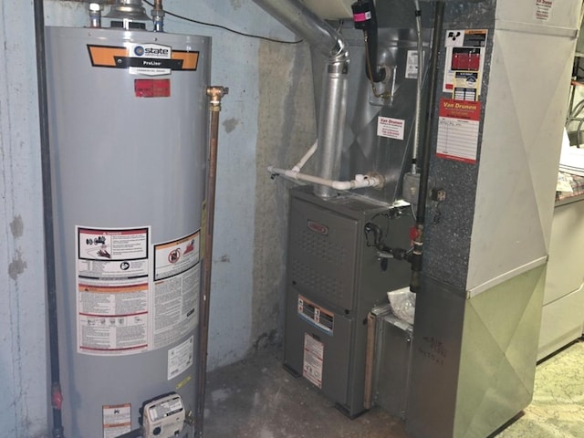 utility room featuring heating unit and gas water heater