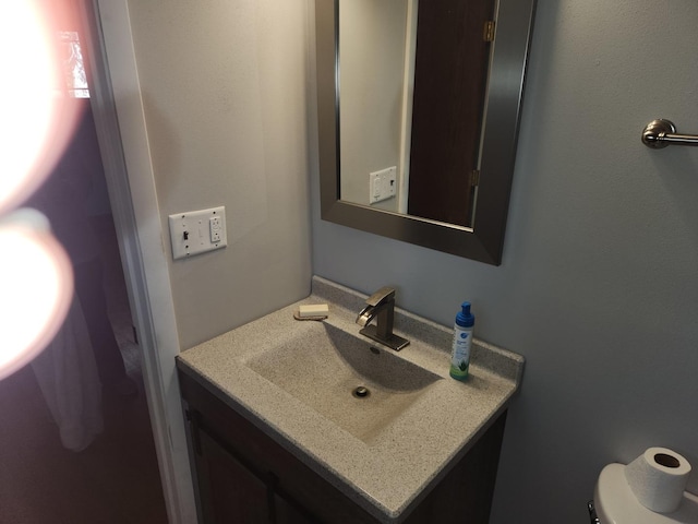 half bath with toilet and vanity