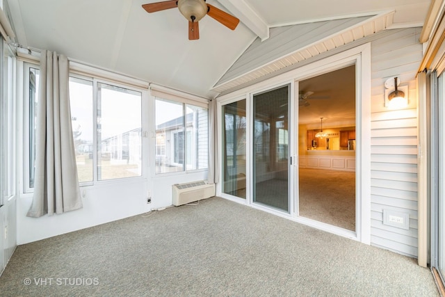 unfurnished sunroom featuring lofted ceiling with beams, an AC wall unit, and ceiling fan