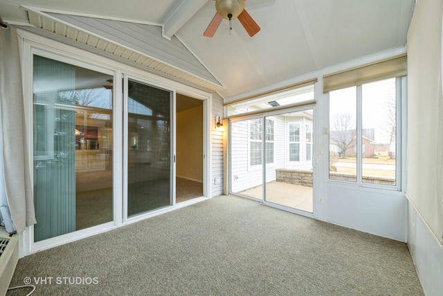 unfurnished sunroom featuring lofted ceiling with beams, a healthy amount of sunlight, and ceiling fan