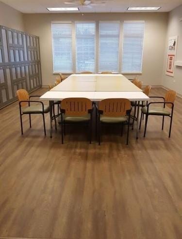 dining space with wood finished floors