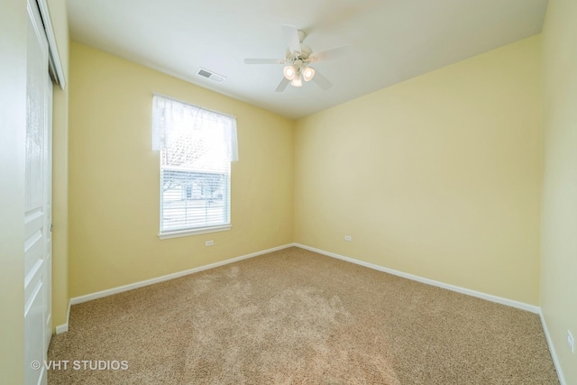 unfurnished bedroom featuring baseboards, visible vents, ceiling fan, a closet, and carpet flooring