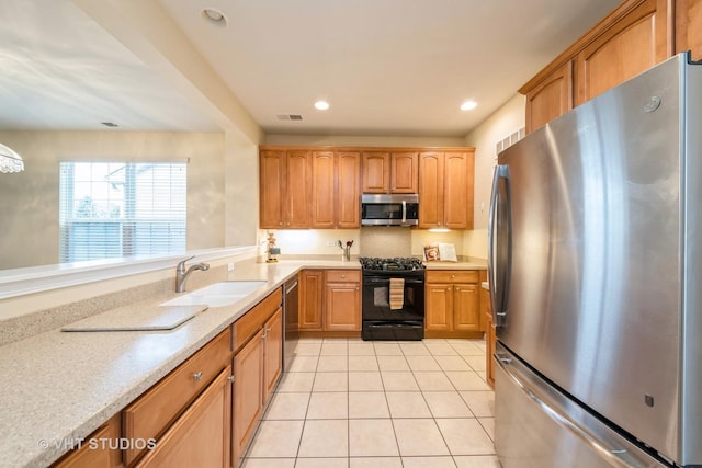 kitchen with visible vents, recessed lighting, appliances with stainless steel finishes, light tile patterned flooring, and a sink