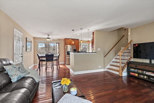 living area featuring recessed lighting, stairway, wood-type flooring, baseboards, and ceiling fan