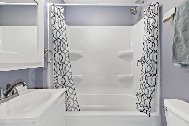 bathroom featuring vanity, toilet, and shower / bath combo with shower curtain