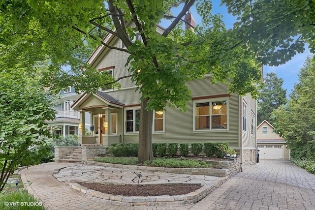 view of front of house with an outbuilding