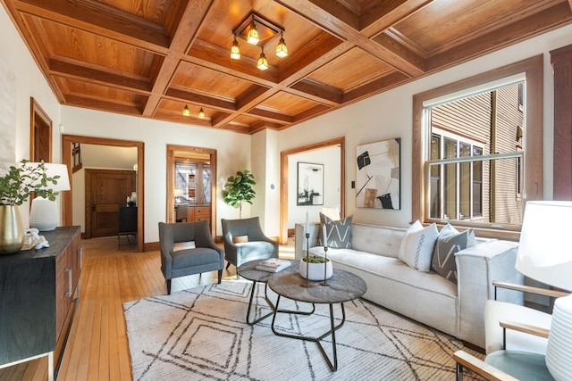 living area with light wood-type flooring, wooden ceiling, coffered ceiling, and beam ceiling