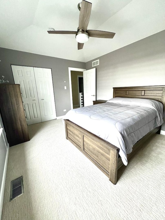 bedroom with carpet floors, baseboards, visible vents, and a closet