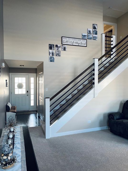 entryway with stairway and baseboards