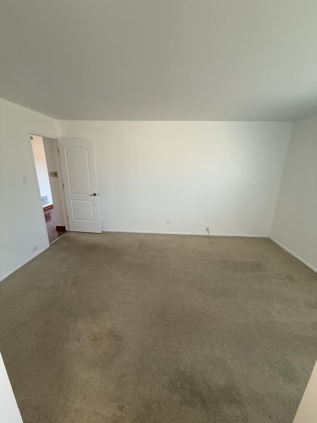 unfurnished room featuring carpet flooring