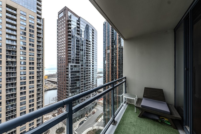 balcony with a city view and a water view