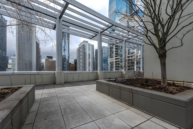 view of patio / terrace featuring a city view and a pergola