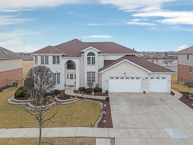 view of front of property with a garage, concrete driveway, a front lawn, and a shingled roof