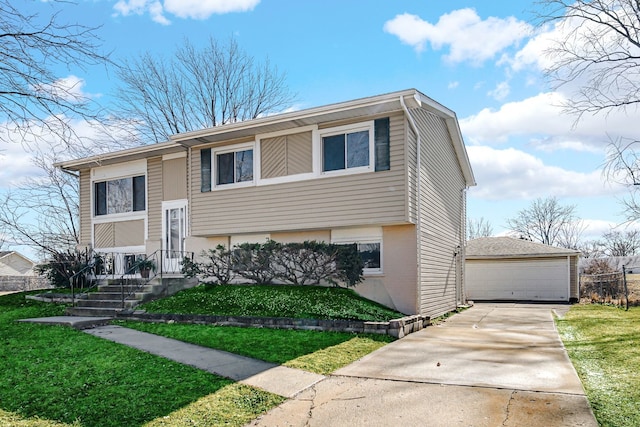 raised ranch with an outbuilding, a front lawn, and a detached garage