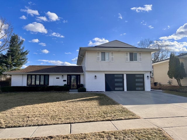 view of front of home featuring driveway, a garage, brick siding, and a front lawn