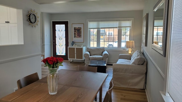 dining area featuring baseboards and wood finished floors