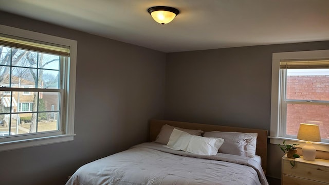 bedroom featuring multiple windows