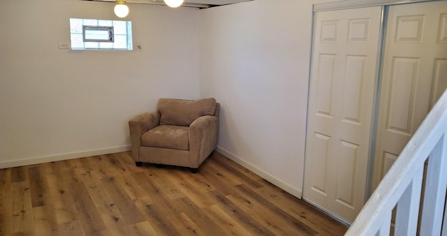 sitting room with light wood-style flooring and baseboards