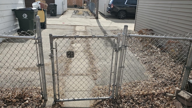 exterior space featuring fence and a gate