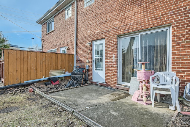 view of patio / terrace featuring fence