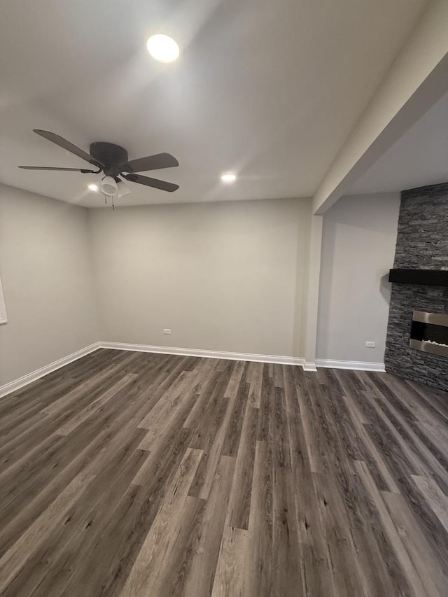 7929 S Manistee Ave, Chicago, IL 60617 - unfurnished living room with ceiling fan, dark wood-type flooring, a stone fireplace, and recessed lighting