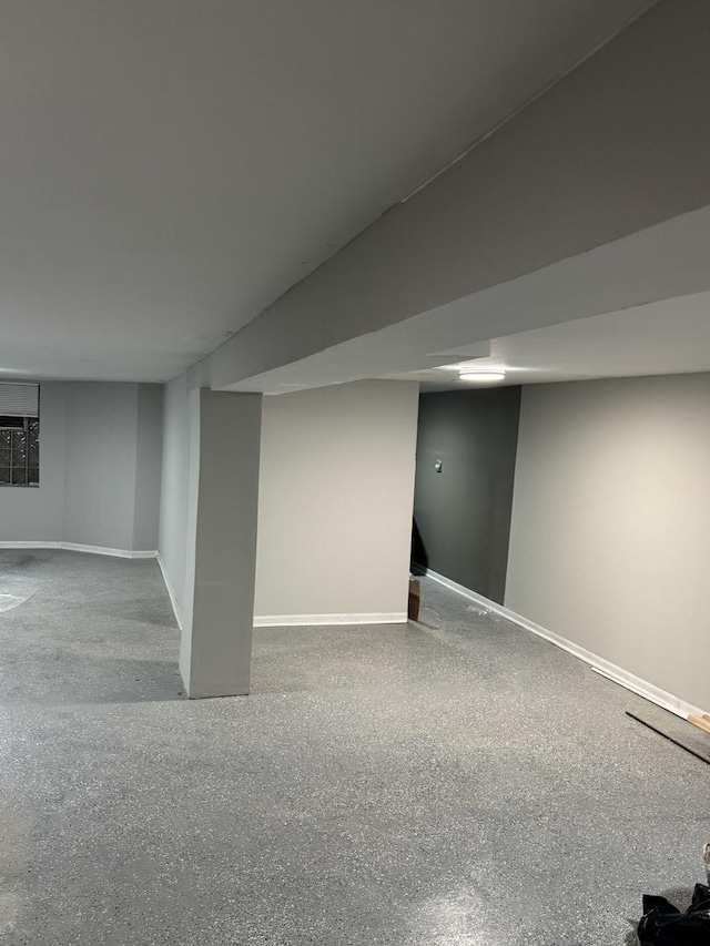 finished basement featuring baseboards