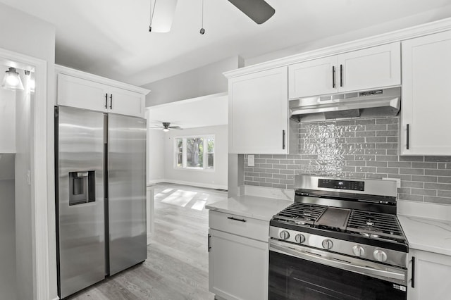 kitchen with tasteful backsplash, under cabinet range hood, ceiling fan, and stainless steel appliances